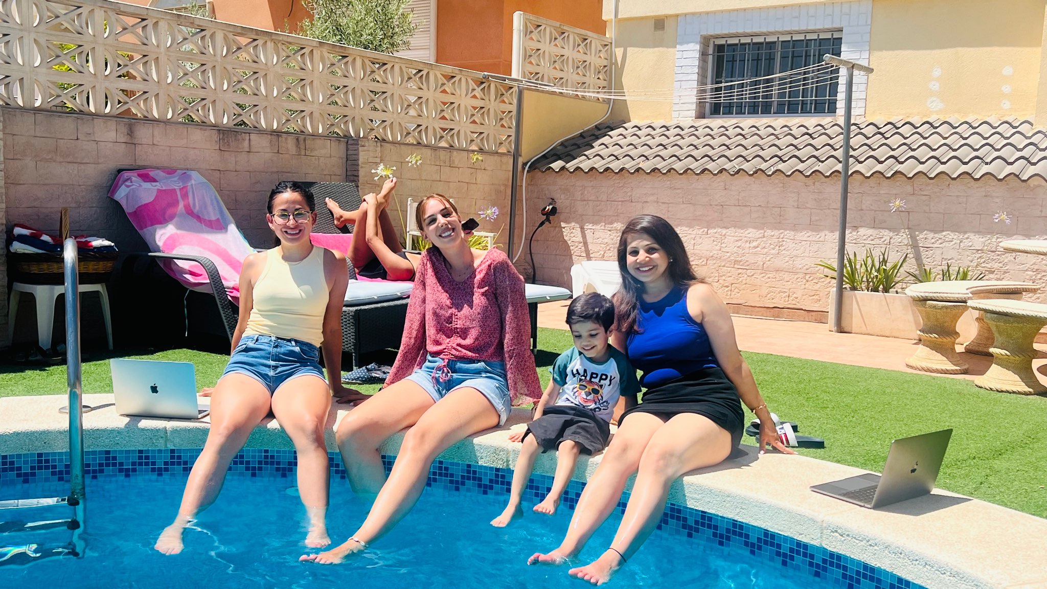 Pebl coworkers relax by the pool