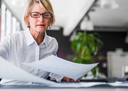 woman reviewing employer burden quotes