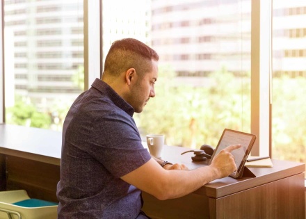Man looking at tablet