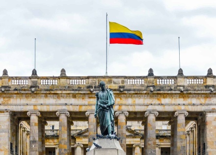 Colombian flag over monument