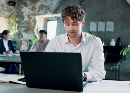 Businessman working on a laptop in an office in Colombia