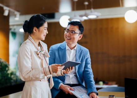 Office workers in China discussing Chinese business etiquette