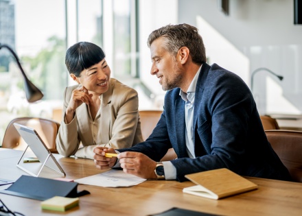 Business people discussing payroll tax in Romania