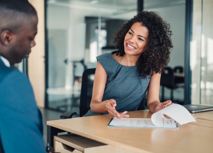 Global HR team members discussing how to hire in Kuwait