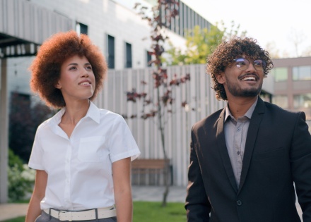  Global HR team members discussing Rwandan work visas outside