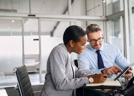 Colleagues discussing how to get work authorization in Iceland