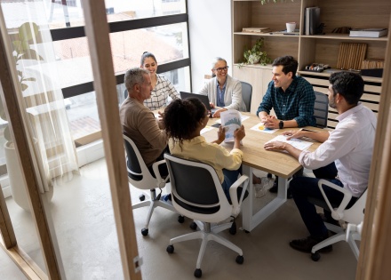 HR team discussing EOR strategies for temporary hiring