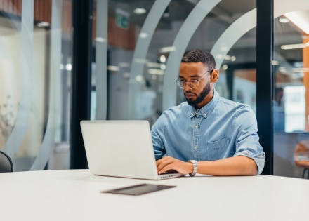 Businessman working on his laptop in an office