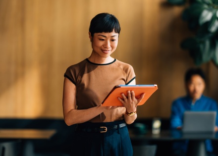 Businesswoman going through her M&A due diligence checklist