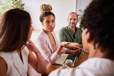 Team discussing CSRD Impact for Managing EU Talent