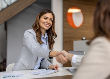 Businesswoman shaking hands after discussing salary in Lebanon