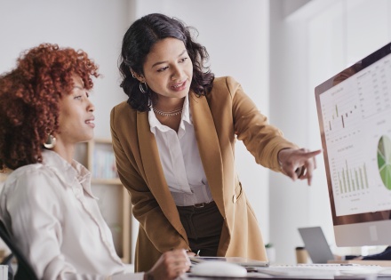 Payroll team members discussing how long payroll takes to process