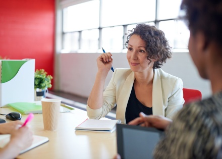 Business leaders discussing the top emerging markets in 2025