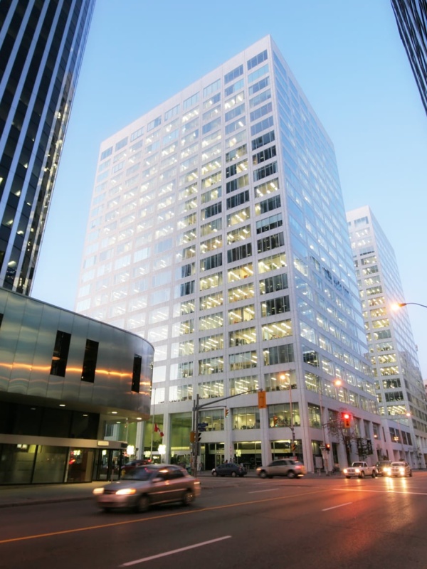 Blurry view of downtown city high rises at sunset.