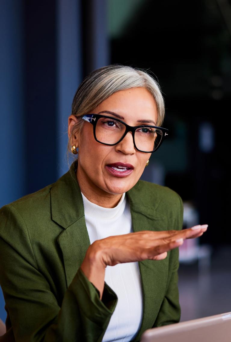 Financial industry businesswoman in meeting discussing global expansion with EOR.