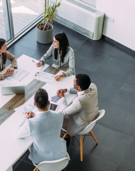 Team meeting among four colleagues discussing global expansion.