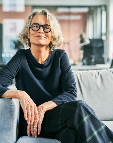 EOR expert sitting on couch looking directly at the photographer.