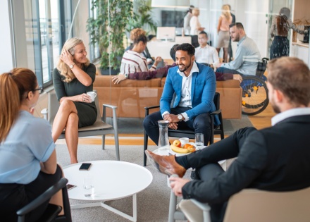 A diverse team collaborate on providing global mobility and EoR services to their clients