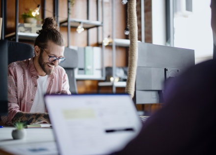 Man researching how to get a work visa in Algeria for his employees