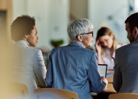 Team meeting reviewing how to get a work visa in Burundi