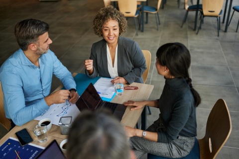 HR manager briefs team on getting work visas in Canada