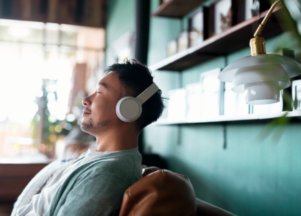 Man listening to music on headphones at the office