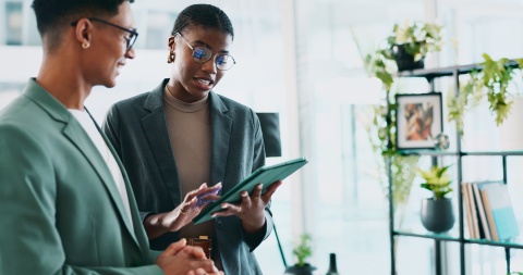 Colleagues discussing hard skills versus soft skills at work