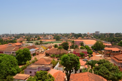 Aerial view Guinea Bissau’s red roofs and lush trees