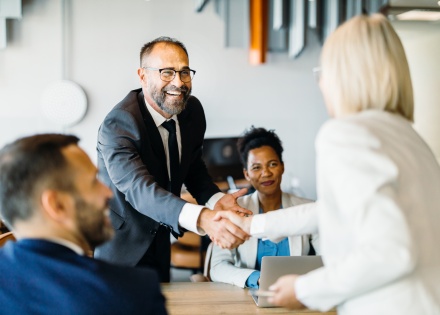 Executives discussing types of organizational structures for businesses