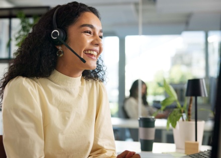 Global HR manager discussing payroll tax in El Salvador on a headset