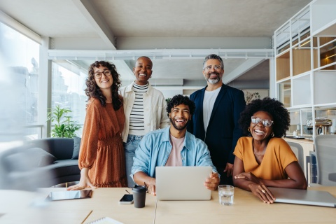 Global HR team poses for a photo at their office