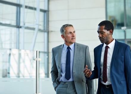 HR managers discussing the average salary in Rwanda