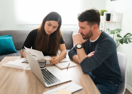 Two business owners reviewing yearly payroll taxes in Puerto Rico
