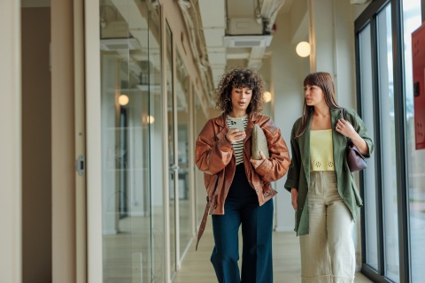 Global HR managers walking and discussing payroll tax in Algeria