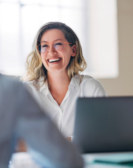 Female employer smiling after Pebl (formerly Velocity Global) partnership.
