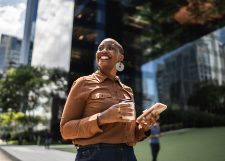 HR manager smiling while reading about work visas in Bahrain