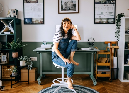 Entrepreneur in her home office thinking about growing her small business