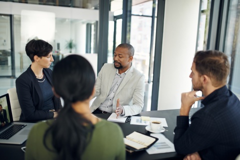 Teams in meeting setting discussing work visas in Gabon