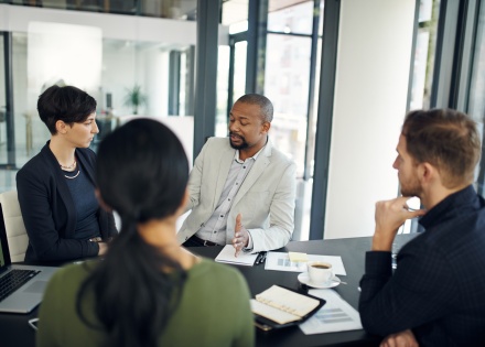 Teams in meeting setting discussing work visas in Gabon