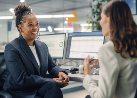 HR employees discussing how to switch payroll providers