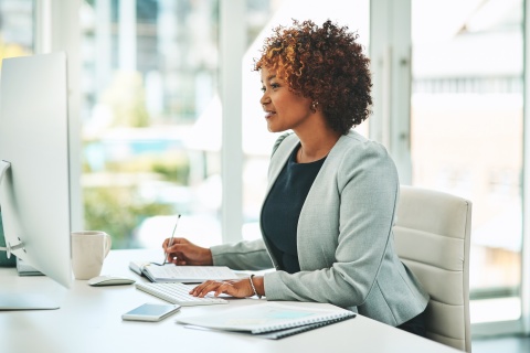 Young businesswoman working on a computer in an office