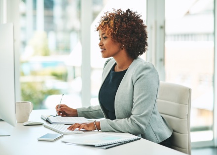 Young businesswoman working on a computer in an office