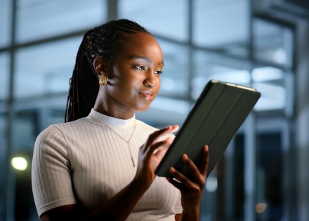 Young woman looking at a digital tablet in Tonga