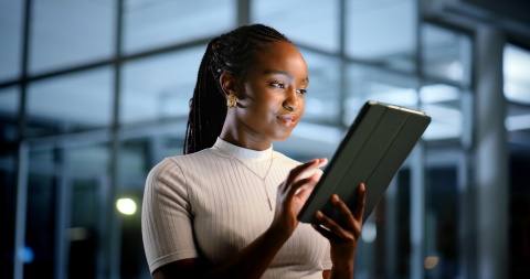 Young woman looking at a digital tablet in Tonga