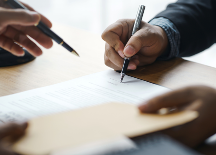 Zoomed in view of two people drafting a Transitional Services Agreement (TSA)
