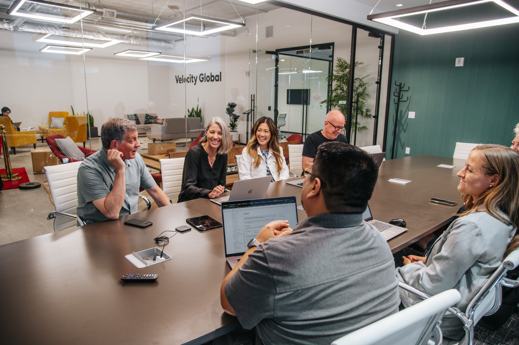 Pebl team members enjoy each other's company for a hybrid all-hands meeting.