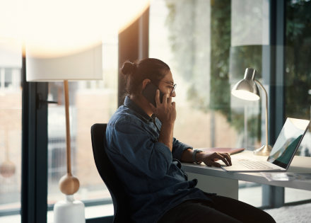 Remote employee takes call at home office